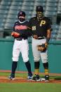 <p>Cesar Hernandez #7 of the Cleveland Indians and first baseman Josh Bell #55 of the Pittsburgh Pirates both stand on first during the first inning at Progressive Field on July 20 in Cleveland.</p>