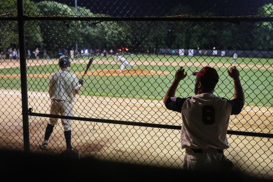 Jarrod Marifiote (right), a Framingham High grad, watches a pitch from the dugout during the 28th annual Abbot Financial Management Oldtime Baseball Game in Cambridge, Aug. 24, 2022. He played in the game and raised money for cancer research for the Jimmy Fund. 