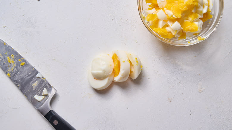 peeled and chopped eggs on table