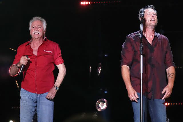 <p>WENN Rights Ltd / Alamy</p> Joe Bonsall and Blake Shelton performing in Nashville in June 2016