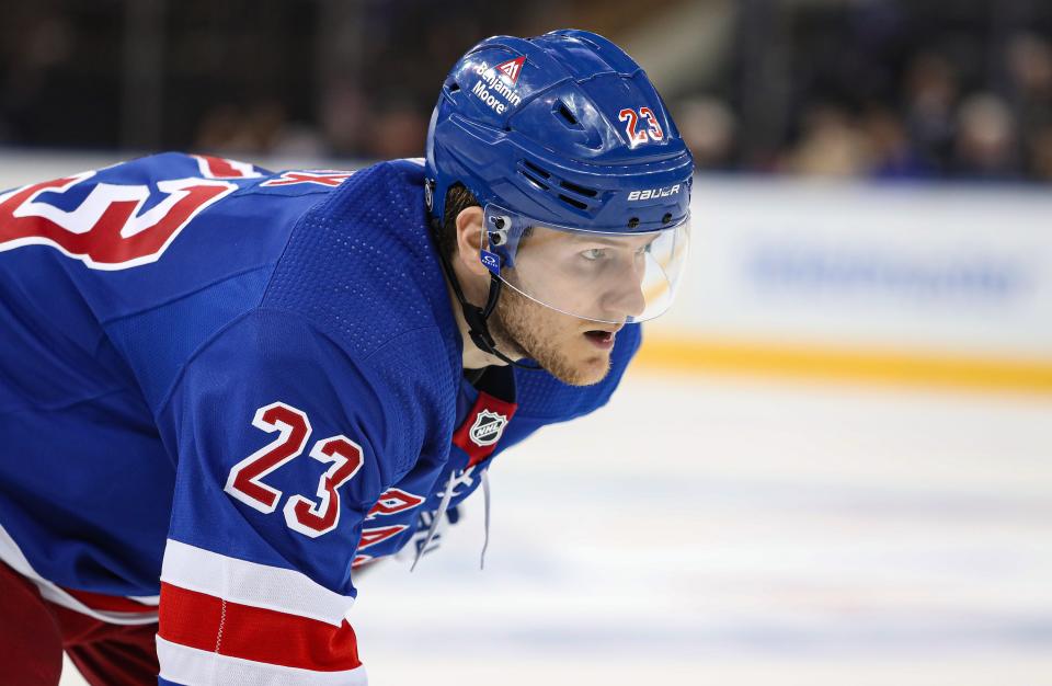 Apr 11, 2024; New York, New York, USA; New York Rangers defenseman Adam Fox (23) awaits a face-off against the Philadelphia Flyers during the third period at Madison Square Garden.