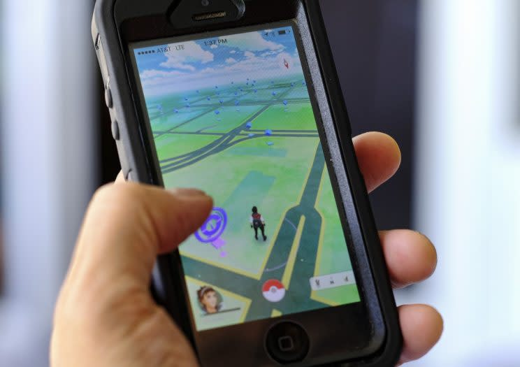 “Pokémon Go” being played on a cell phone. (Photo: Richard Vogel/AP)