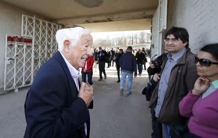 Holocaust survivor Murray Goldfinger tells people how he survived as she visits the former Nazi concentration camp Buchenwald near Weimar, April 12, 2015. REUTERS/Kai Pfaffenbach