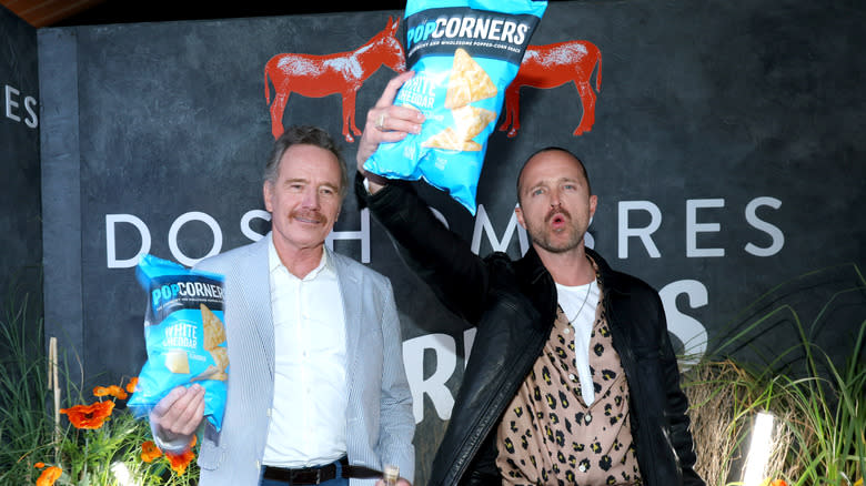 Brian Cranston and Aaron Paul promoting PopCorners at a Dos Hombres mezcal event