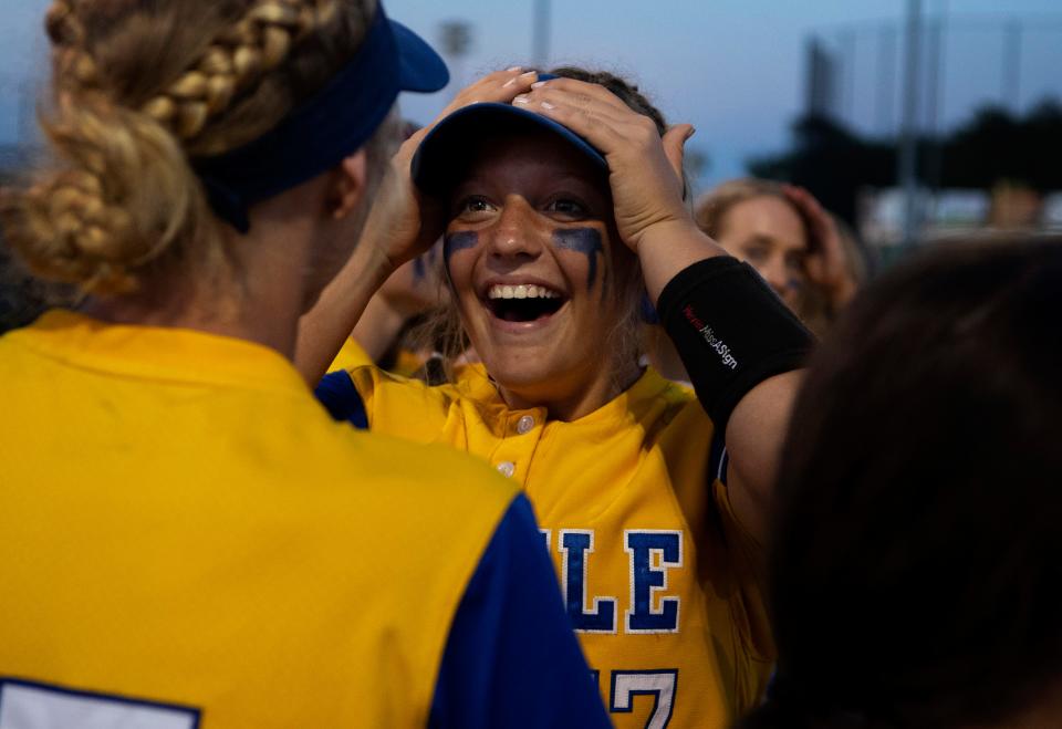 Castle's Kirsten Greenwell (17) celebrates beating Central in the sectional championship game at North High School Saturday evening, May 28, 2022.