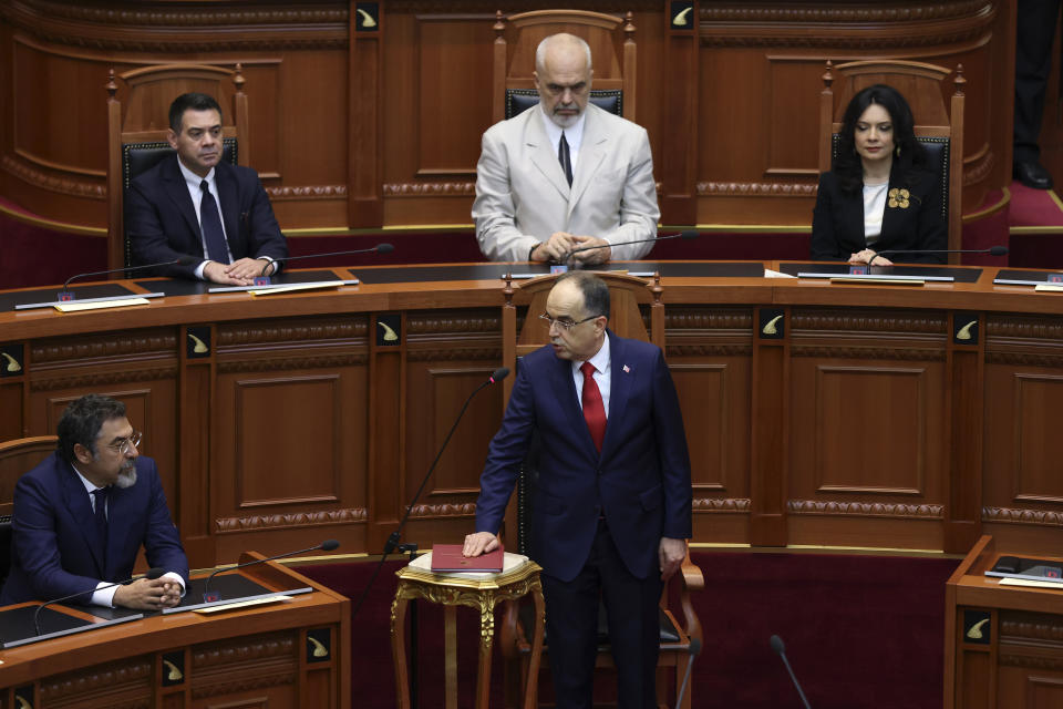 Newly appointed Albanian President Bajram Begaj takes the oath during a swearing in ceremony at the parliament in Tirana, Sunday, July 24, 2022. Albania's new president sworn in on Sunday calling on the country's political parties to cooperate and consolidate the rule of law. (AP Photo/Franc Zhurda)