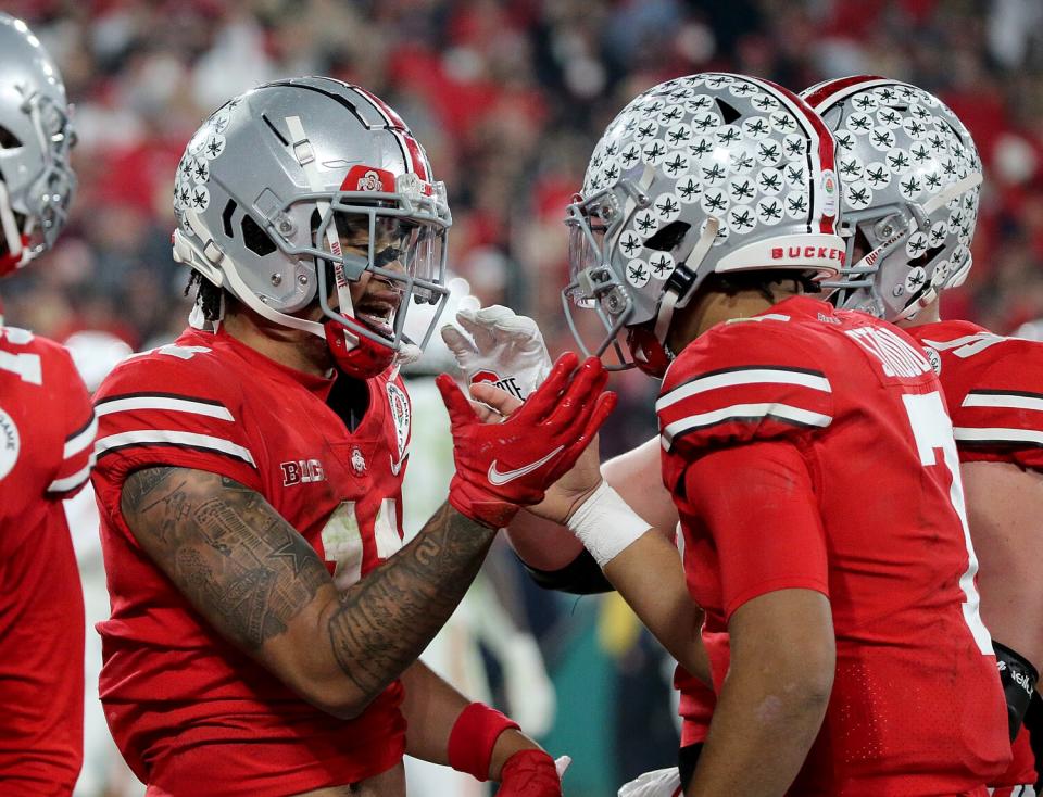 Ohio State wide receiver Jaxon Smith-Njigba and quarterback CJ Stroud celebrate a touchdown pass.