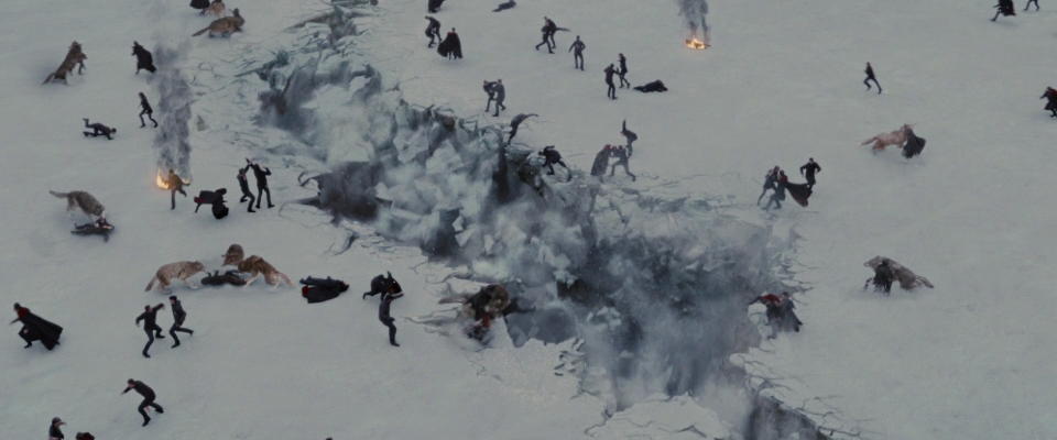 A still from Twilight Breaking Dawn Part Two shows a fault line covered with bodies and fighters