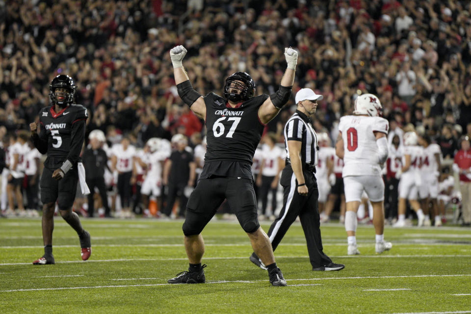 Cincinnati offensive lineman Luke Kandra (67) celebrates after quarterback Emory Jones scored a touchdown during the second half of an NCAA college football game against Miami (Ohio), Saturday, Sept. 16, 2023, in Cincinnati. (AP Photo/Jeff Dean)