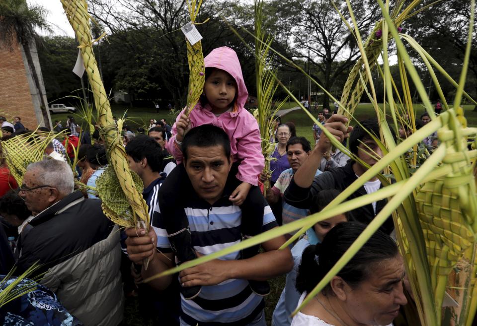 A man attends a Palm Sunday celebration outside the Our Lady of Schoenstatt Sanctuary in Ypacarai