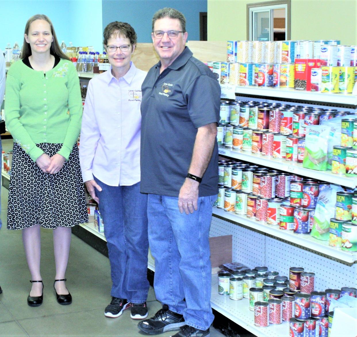 Eva Durbin, left is the Millersburg Food Run race coordinator and Polly and Edgar Raber operate the Love Center Food Pantry in Millersburg, which benefits from the  5k, 10k and 1-mile fun run/walk, that takes place Sunday, Aug. 7.