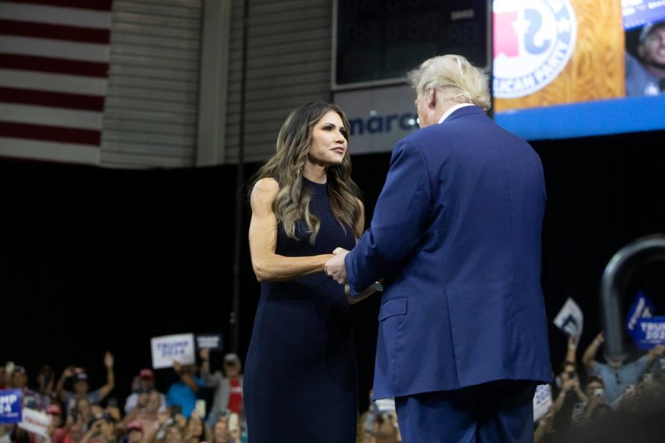 Kristi Noem greets Donald Trump at his rally in South Dakota in September 2023 (Copyright 2023 The Associated Press. All rights reserved)