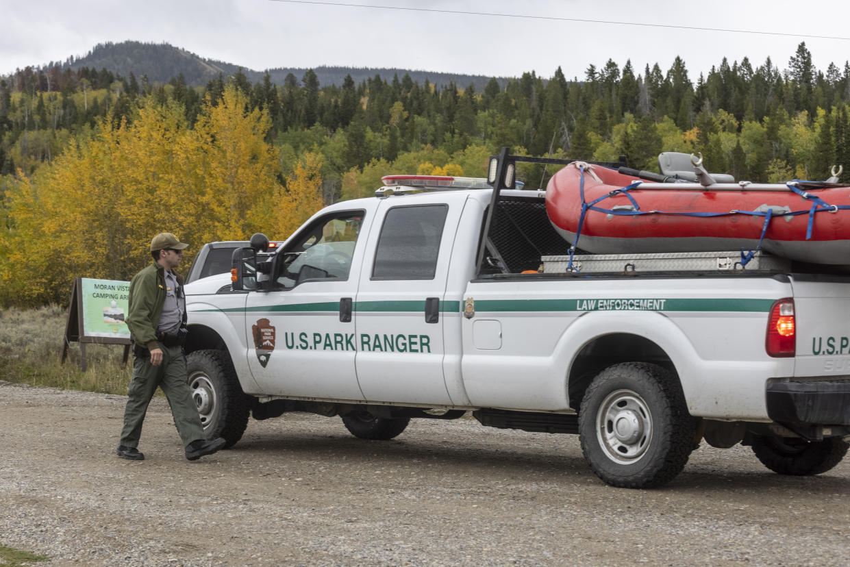 MORAN, WY - SEPTEMBER 19: A park ranger speaks with a colleague on the road to Spread Creek Campground on September 19, 2021 near Moran, Wyoming. Law enforcement searching the area for missing person Gabby Petito found an unidentified body on Sunday. Petito went missing while on a cross-country trip with her fiancé Brian Laundrie. She has not been seen or heard from since late August. Police said no criminality is suspected at this time but Laundrie has refused to speak with law enforcement. Laundrie has been identified as a person of interest.  (Photo by Natalie Behring/Getty Images)