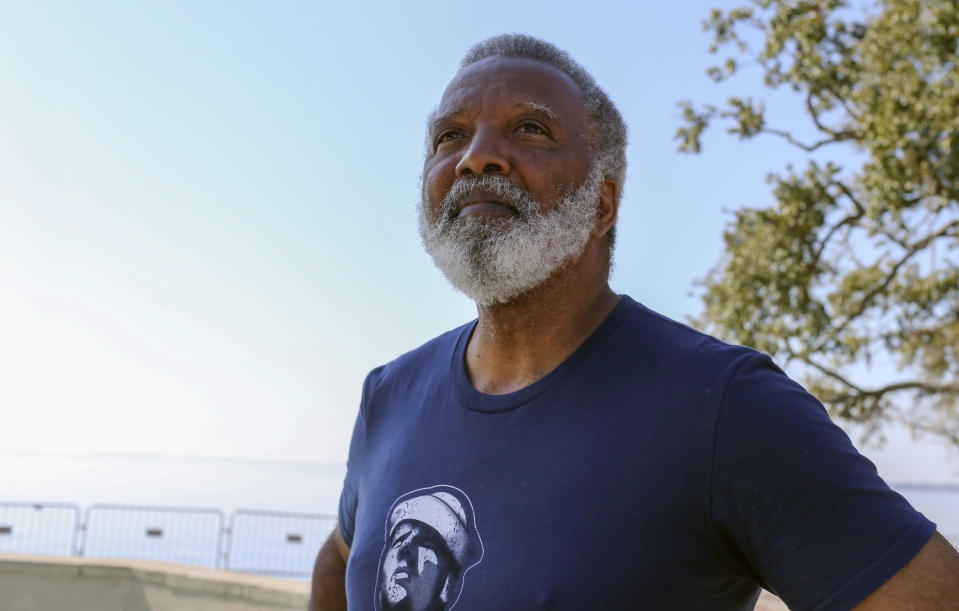 Reuben Green, a retired Black Naval officer who comes from a military family, as both his father and grandfather served, poses for a photo at Memorial Park in Jacksonville, Fla., Friday, Feb. 26, 2021. (AP Photo/Gary McCullough)