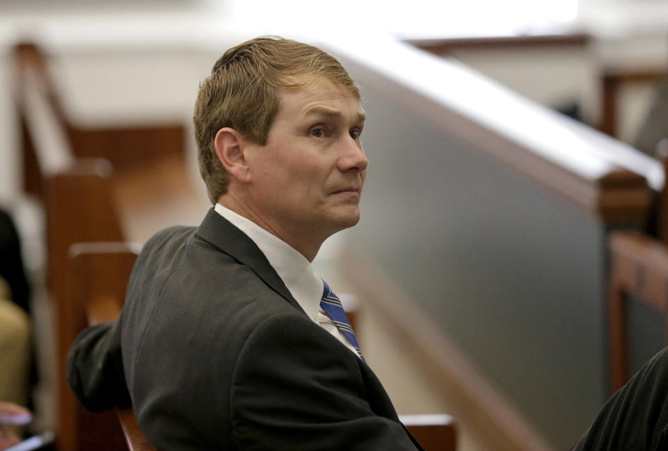 Patrick Jones waits during proceedings at the Orange County Courthouse in Hillsborough, N.C., Monday, April 17, 2017. Jones, 43, was charged in 2013 with athlete-agent inducement for providing $725 to former North Carolina football player Robert Quinn. An indictment stated Jones had provided the money through Quinn's former girlfriend to entice Quinn to sign with agent Terry Watson. (AP Photo/Gerry Broome)