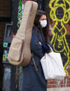 <p>Katie Holmes is almost unrecognizable while toting her guitar through N.Y.C.'s SoHo neighborhood on Tuesday.</p>