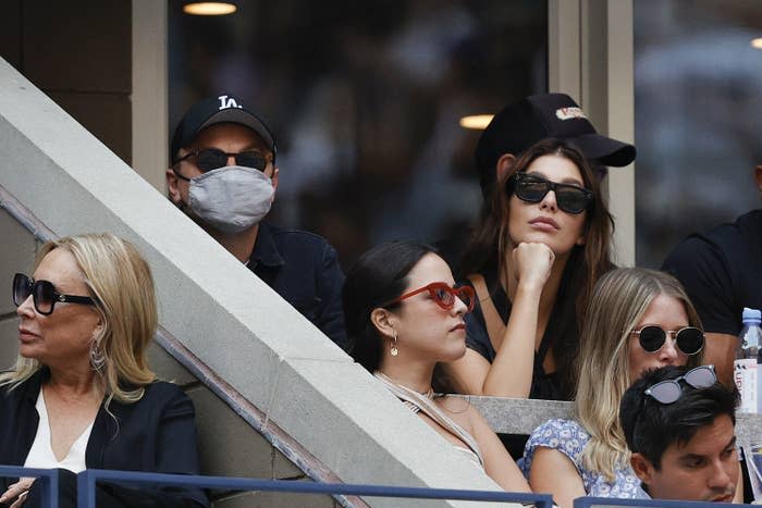 leonardo dicaprio and camila morrone at a sports game