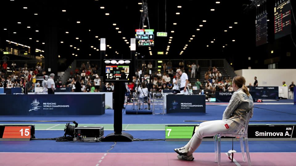 Russian Anna Smirnova remains seated after facing Ukraine's Olga Kharlan. - Tibor Illyes/MTI/AP