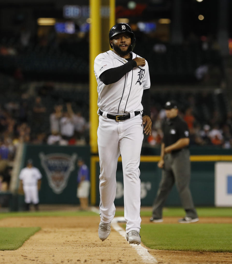 Detroit Tigers designated hitter Ronny Rodriguez runs to home plate from third after his triple was reviewed as a two-run home run during the sixth inning of a baseball game against the Minnesota Twins, Saturday, Aug. 31, 2019, in Detroit. (AP Photo/Carlos Osorio)