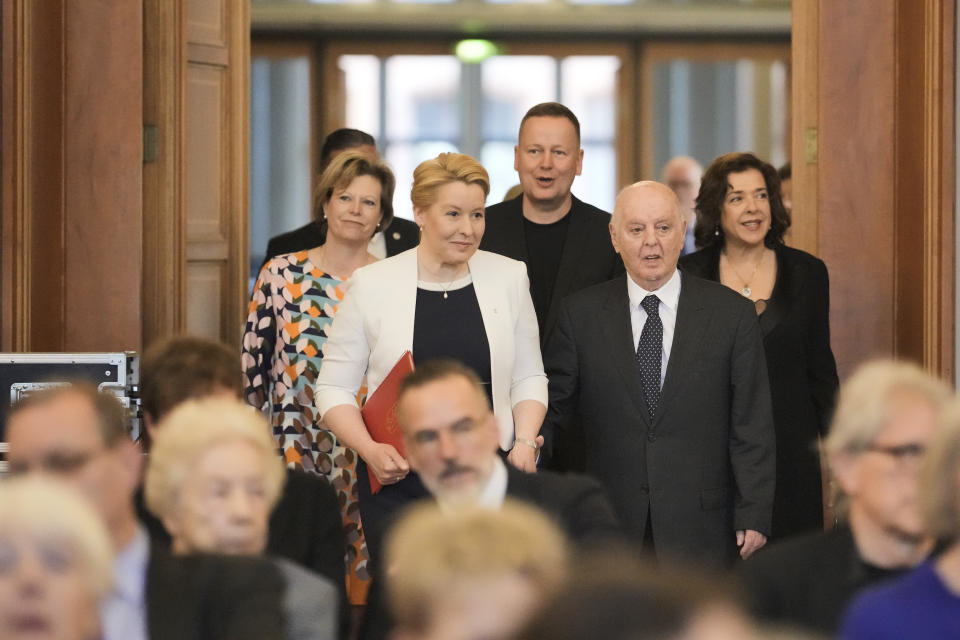 Pianist and conductor Daniel Barenboim, center right, arrives with Berlin Mayor Franziska Giffey, center left, for a ceremony to award him honorary citizenship of the German capital in Berlin, Germany, Friday, April 21, 2023. Barenboim stepped down as the Berlin’s State Opera’s music director after 30 years in February for health reasons. (AP Photo/Markus Schreiber)