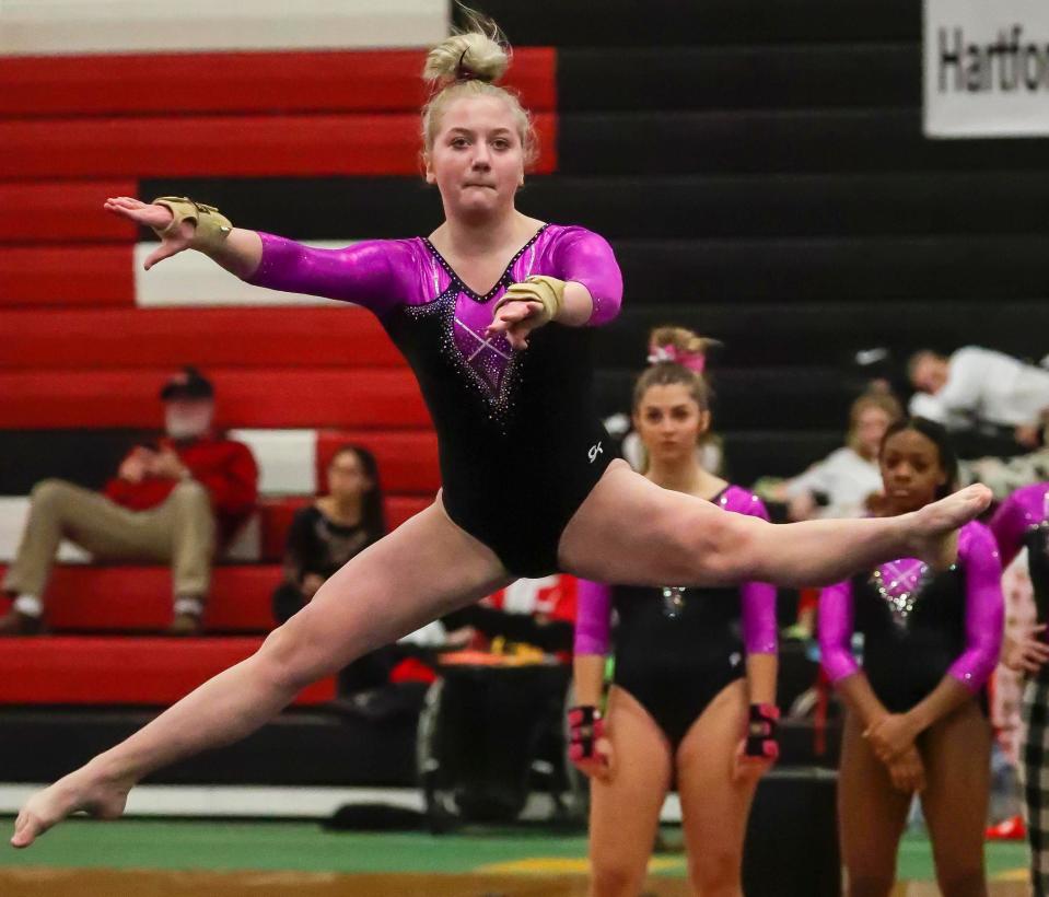 Oshkosh's Lydia Barr leaps during her floor exercise routine at the Manitowoc Ships Holiday Gymnastics Invite on Dec. 10. Barr will compete in the all-around at the Division 1 state meet Saturday in Wisconsin Rapids.
