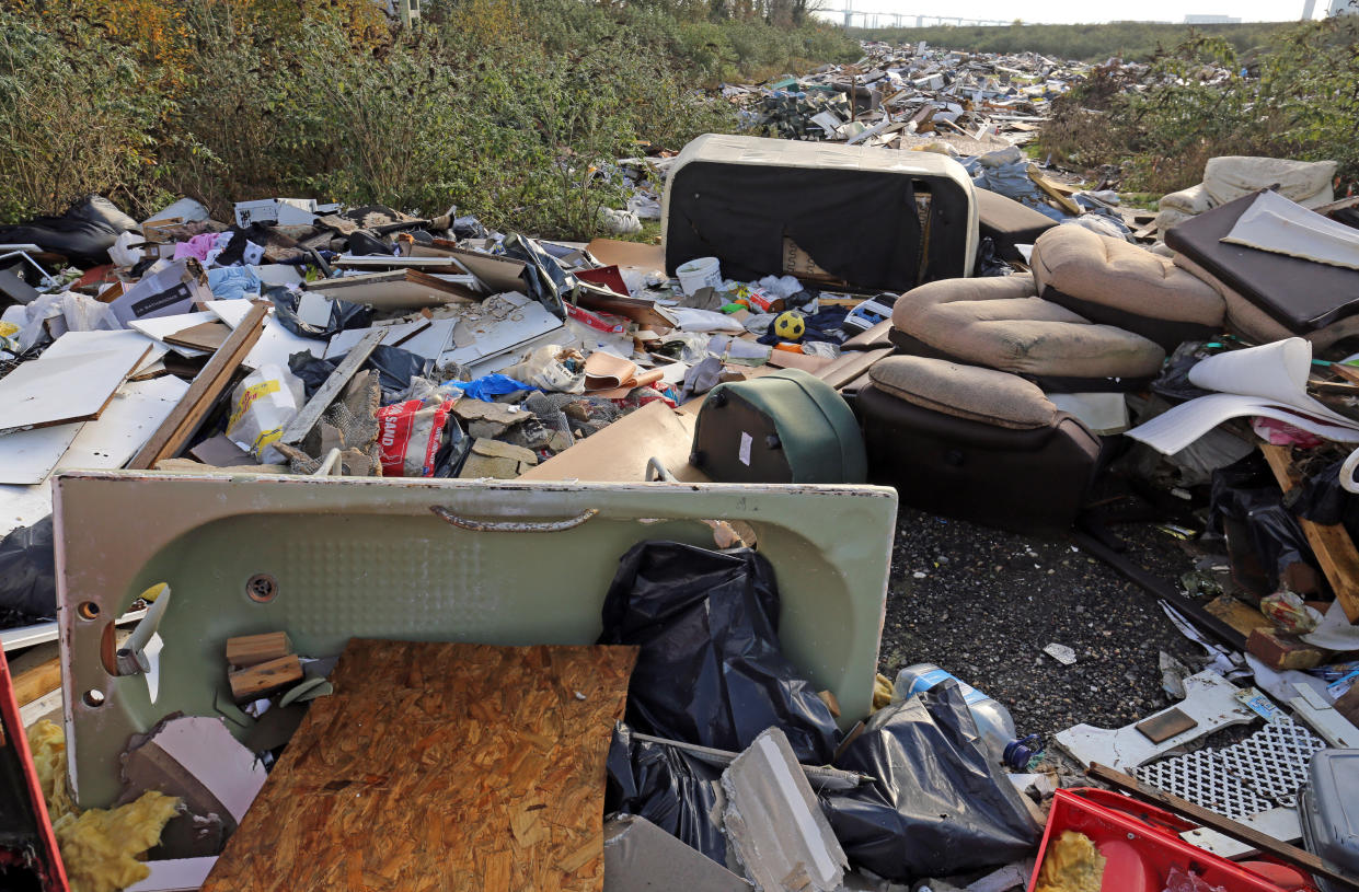 An illegal fly tip site alongside the Thames estuary at Purfleet in Essex.