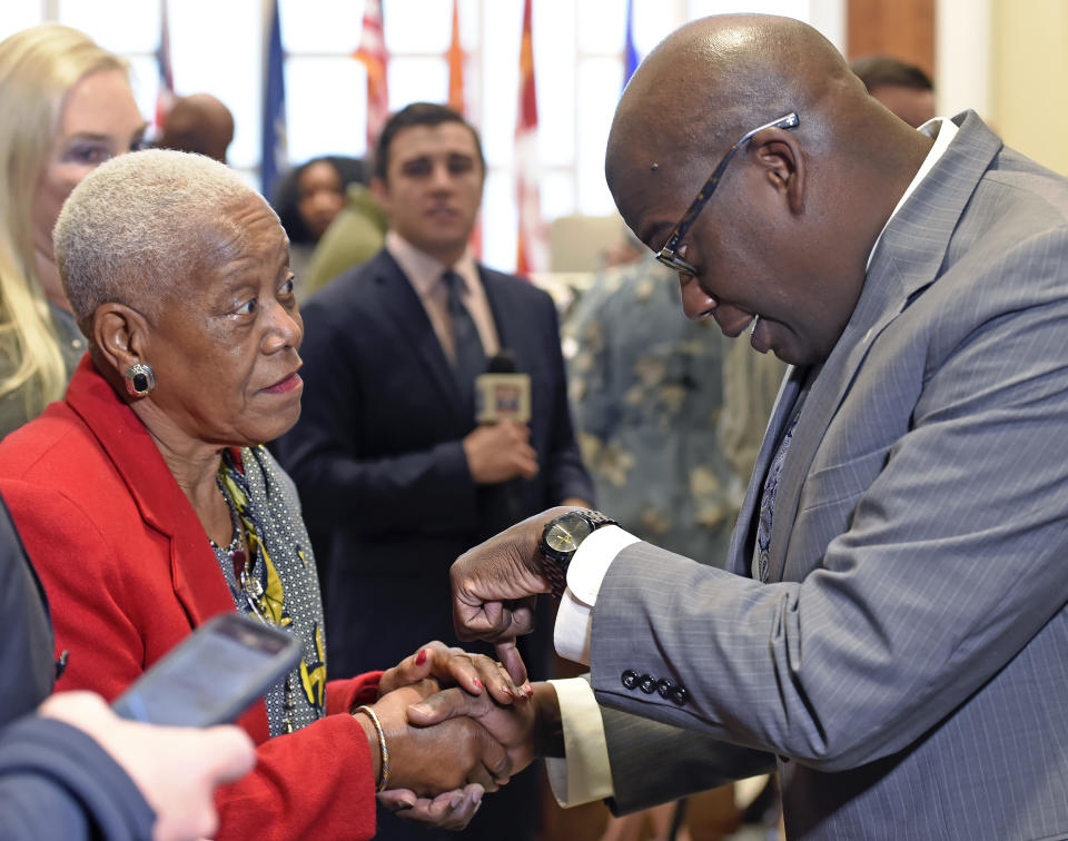 In a Friday Dec. 29, 2017 photo, Sadie Roberts-Joseph, left, chats with Louisiana State Police Lt. Col. Murphy Paul, right, who was appointed as the new Chief of Police for the Baton Rouge Police Department by Mayor-President Sharon Weston Broome, in Baton Rouge, La. East Baton Rouge Coroner Beau Clark released preliminary autopsy results Monday, July 15, 2019 that show Sadie Roberts-Joseph was suffocated to death before her body was found in the trunk of a car on July 9. (Bill Fei/The Advocate via AP)