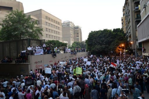 Thousands protest outside the US embassy in Cairo against a film deemed offensive to Islam. Demonstrators tore down the Stars and Stripes at the US embassy in Cairo on Tuesday and replaced it with an Islamic flag on the annniversary of September 11