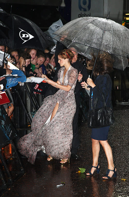 Emma Watson’s dress flies up while signing autographs