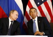 U.S. President Barack Obama (R) meets with Russia's President Vladimir Putin in Los Cabos, Mexico, in this June 18, 2012 file photo. To match Special Report UKRAINE-PUTIN/DIPLOMACY REUTERS/Jason Reed/Files (MEXICO - Tags: POLITICS)