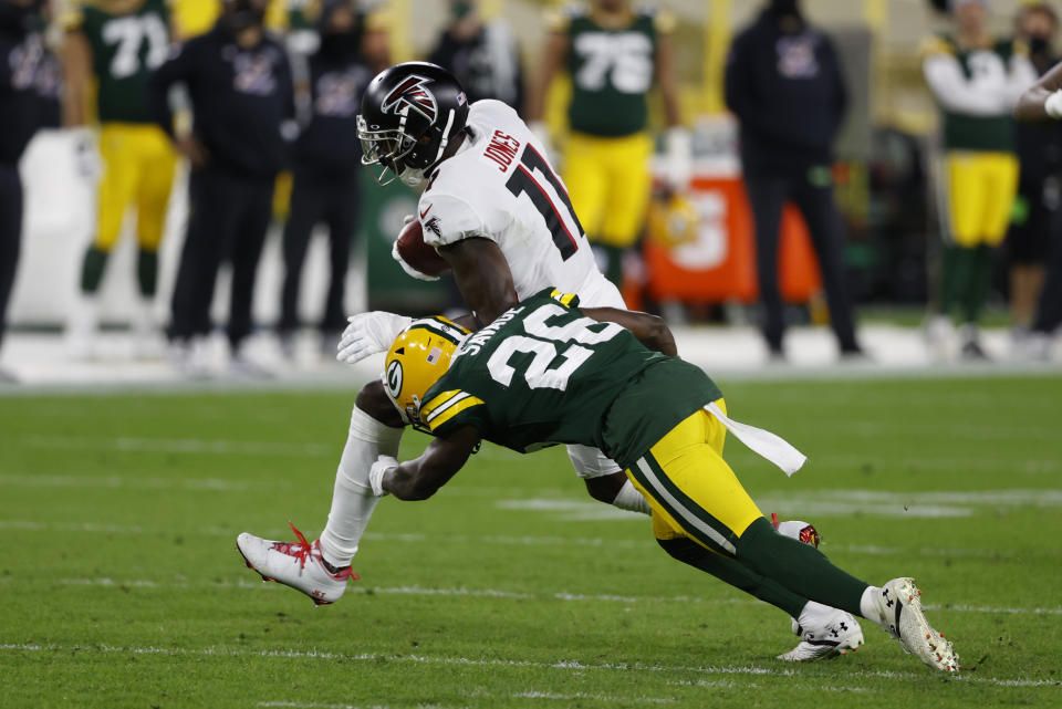 Julio Jones is hit by the Packers' Darnell Savage during the first half.