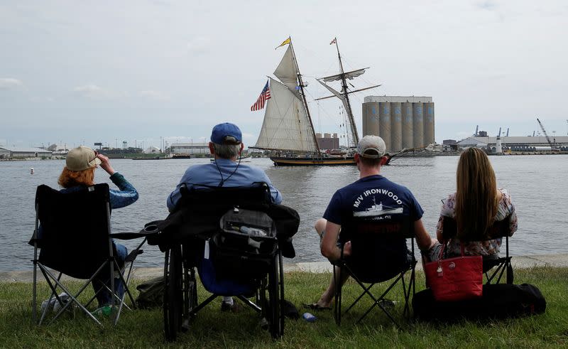 FILE PHOTO: People watch the Pride of Baltimore, a tall sailing ship, as it departs Baltimore Harbor to greet incoming ships near Fort McHenry in Baltimore