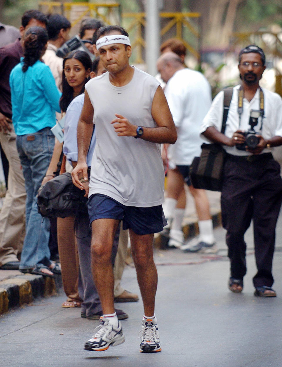Anil Ambani, head of India's largest private sector company Reliance Industries, runs from his home to a polling stating to be one of the first to cast his vote when polling stations opened at 7:00 am (0130 GMT) in Bombay, 26 April 2004. Ambani, a marathon runner, jogged to and from the polling station in southern Bombay as the third phase of India's general elections, the world's largest democratic exercise, got under way with more than 172 million people eligible to vote for 1,278 candidates in 137 constituencies. AFP PHOTO/Rob ELLIOTT