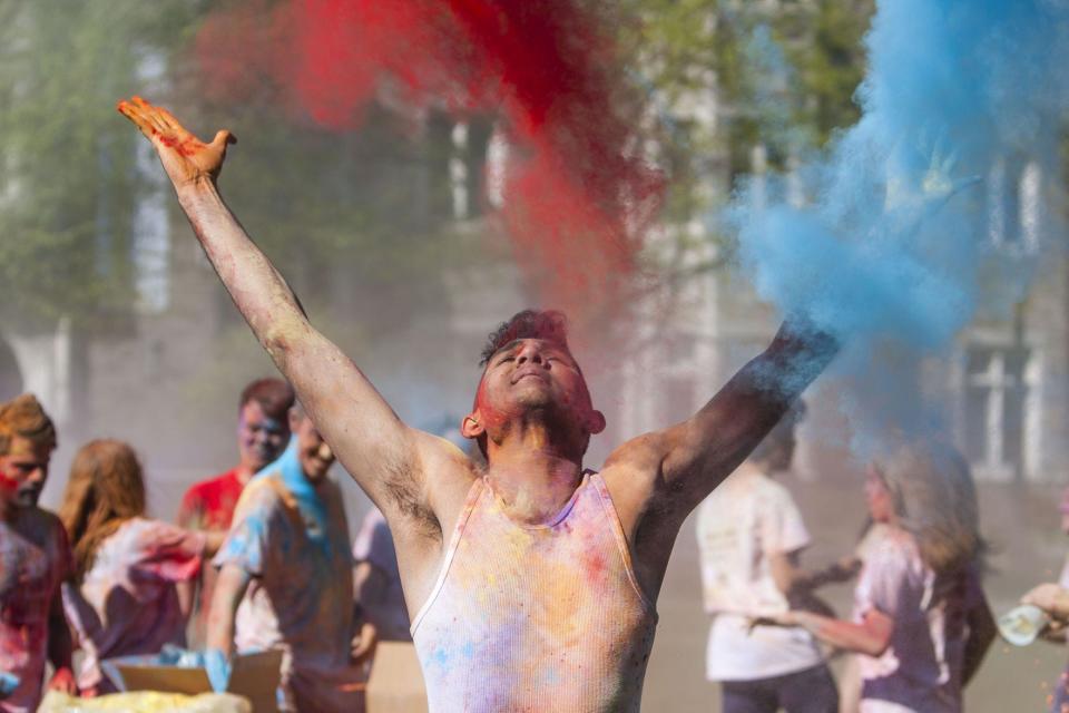 Noble Patidar celebrates Holi on Friday, April 26, 2019, at the South Quad on the campus of Notre Dame. Holi, an Indian cultural event, marks the coming of spring or dry season in India and is celebrated by throwing powdered colors. Patidar, a member of the South Asian Student Association at Notre Dame, organized the annual event.