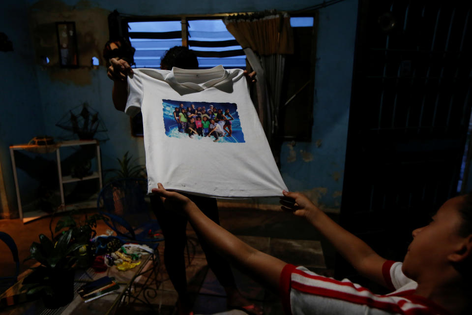 Relatives of Maroly Bastardo show a T-shirt of Maroly at their home in El Tigre, Venezuela, on June 4. (Photo: Ivan Alvarado/Reuters)