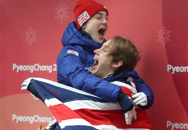 Lizzy Yarnold, right, and Laura Deas celebrate their 2018 Olympic medals