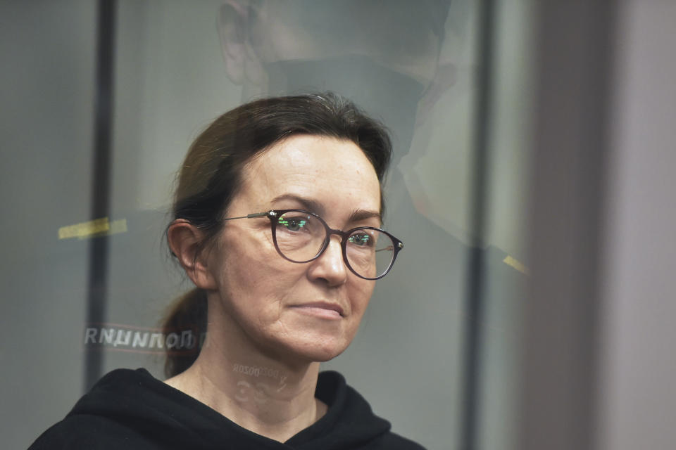 Radio Free Europe-Radio Liberty's editor Alsu Kurmasheva stands in a glass cage in a courtroom in Kazan, Russia, Thursday, Feb. 1, 2024. A Russian court on Thursday ordered a detained Russian-American journalist to be held in jail for two more months pending her trial on charges of failing to register as a foreign agent. (AP Photo/Vladislav Mikhnevskii)