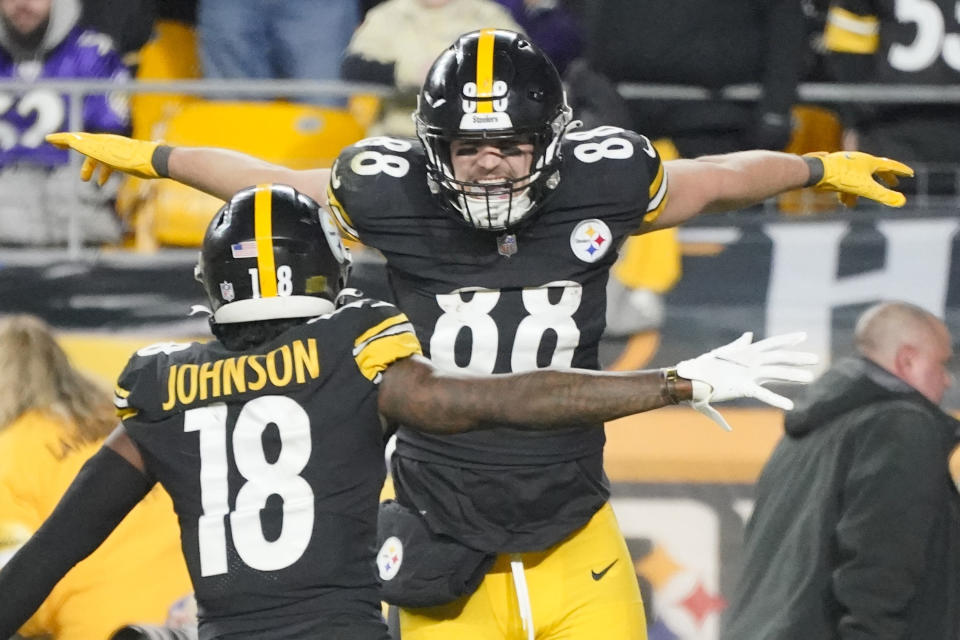 Pittsburgh Steelers tight end Pat Freiermuth (88) celebrates with wide receiver Diontae Johnson (18) after making a catch for a two-point conversion against the Baltimore Ravens during the second half of an NFL football game, Sunday, Dec. 5, 2021, in Pittsburgh. (AP Photo/Gene J. Puskar)