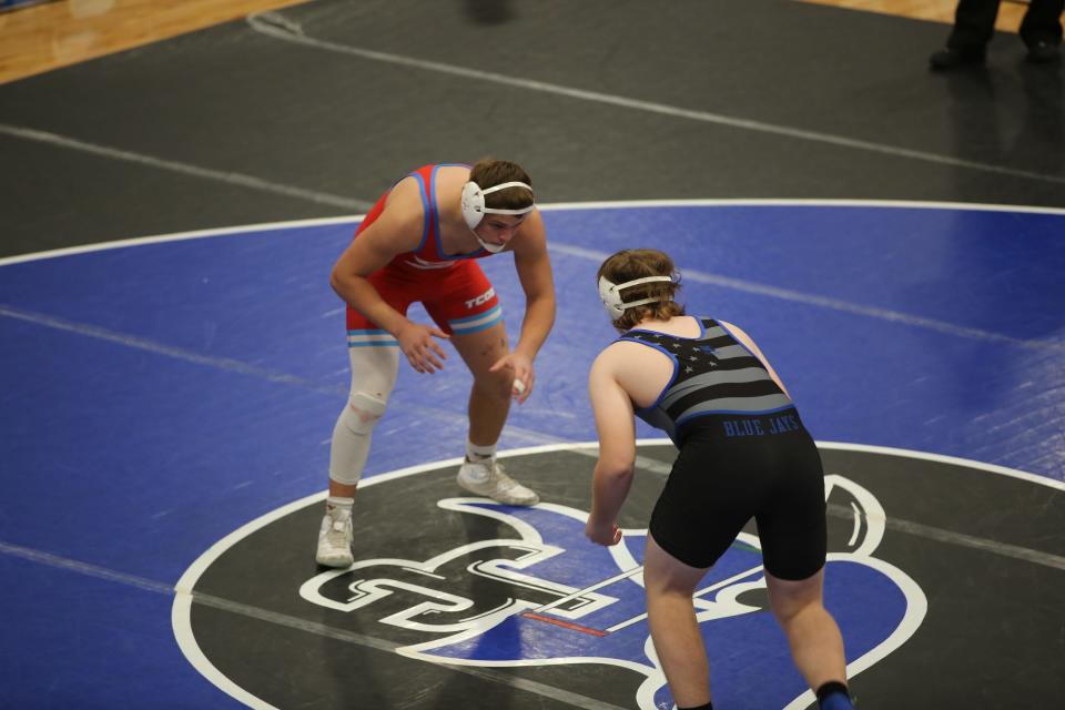 Shawnee Heights' Sean Wunder sizes up his opponent during a dual against Junction City earlier in the year.