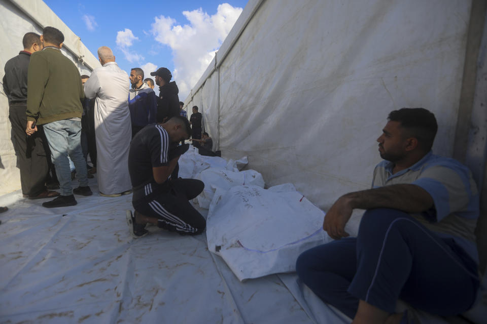 Palestinians mourn their relatives killed in the Israeli bombardment in Rafah, Gaza Strip, Tuesday, May 7, 2024. (AP Photo/Ismael Abu Dayyah)