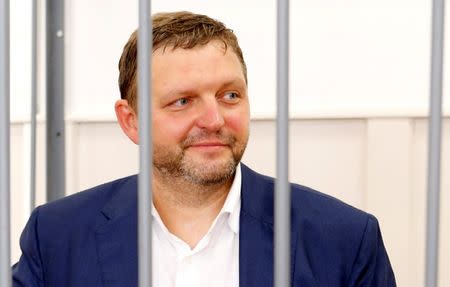 Governor of Kirov region Nikita Belykh, who is accused by the Investigative Committee of taking a bribe, stands inside a defendants' cage during a hearing at the Basmanny district court in Moscow, Russia, June 25, 2016. REUTERS/Maxim Zmeyev