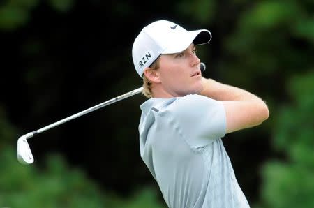 Aug 31, 2014; Norton, MA, USA; Russell Henley hits his tee shot on the 3rd hole during the third round of the Deutsche Bank Championship golf tournament at TPC of Boston. Mark Konezny-USA TODAY Sports