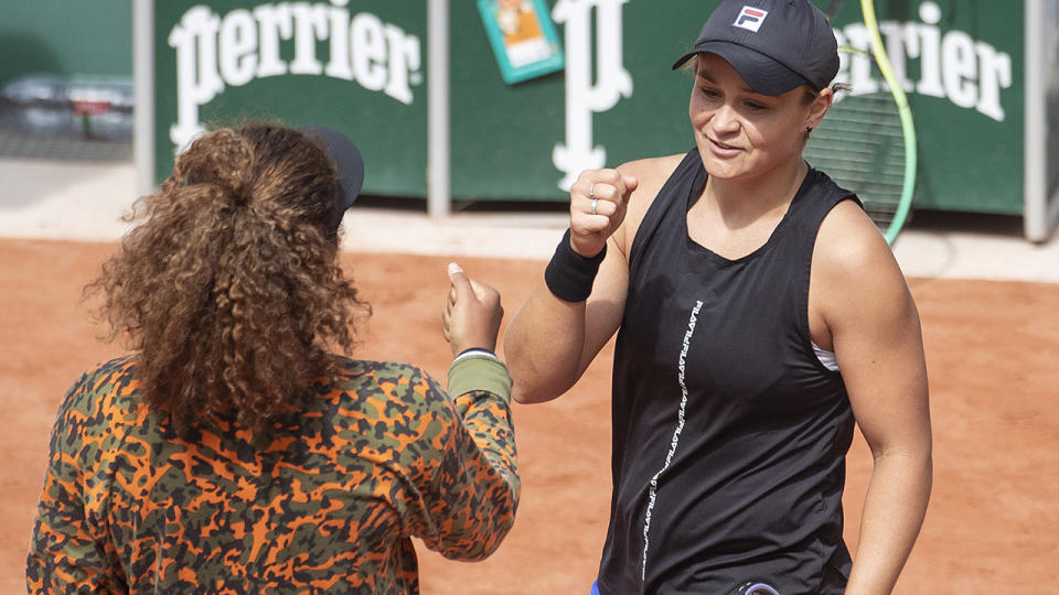 Naomi Osaka and Ash Barty, pictured here on the practice court at Roland Garros.