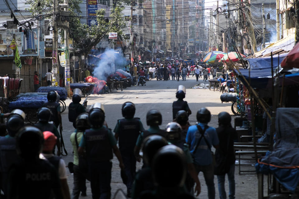 Police fire tear gas shells to disperse Bangladeshi garment factory workers who were blocking traffic demanding better wages at Dhaka-Mirpur area in Bangladesh, Thursday, Nov.2, 2023. (AP Photo/Mahmud Hossain Opu)