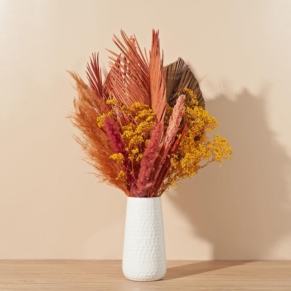 <p><a href="https://go.redirectingat.com?id=74968X1596630&url=https%3A%2F%2Fbouqs.com%2Fflowers%2Fdried%2Fcopper-pampas-terracotta-wheat-sago-palm&sref=https%3A%2F%2Fwww.thepioneerwoman.com%2Fholidays-celebrations%2Fgifts%2Fg39504136%2Fgifts-for-daughter-in-law%2F" rel="nofollow noopener" target="_blank" data-ylk="slk:Shop Now;elm:context_link;itc:0;sec:content-canvas" class="link ">Shop Now</a></p><p>Terracotta Dried Floral Bouquet</p><p>bouqs.com</p><p>$99.00</p><span class="copyright">The Bouqs Co.</span>