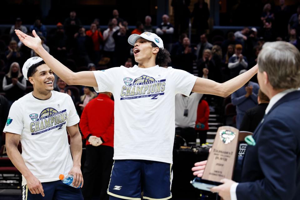 Akron's Enrique Freeman celebrates a win over Kent State for the championship of the Mid-American Conference tournament, Saturday, March 12, 2022, in Cleveland. Freeman was named tournament MVP.