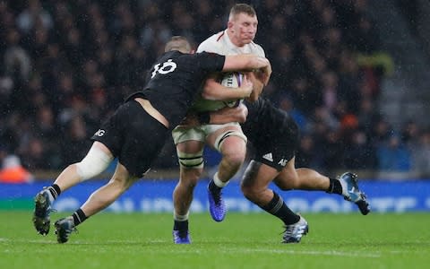 Sam Underhill of England is tackled by Dane Coles of New Zealand All Blacks during the Quilter International match between England and New Zealand at Twickenham Stadium - Credit: Henry Browne/Getty 