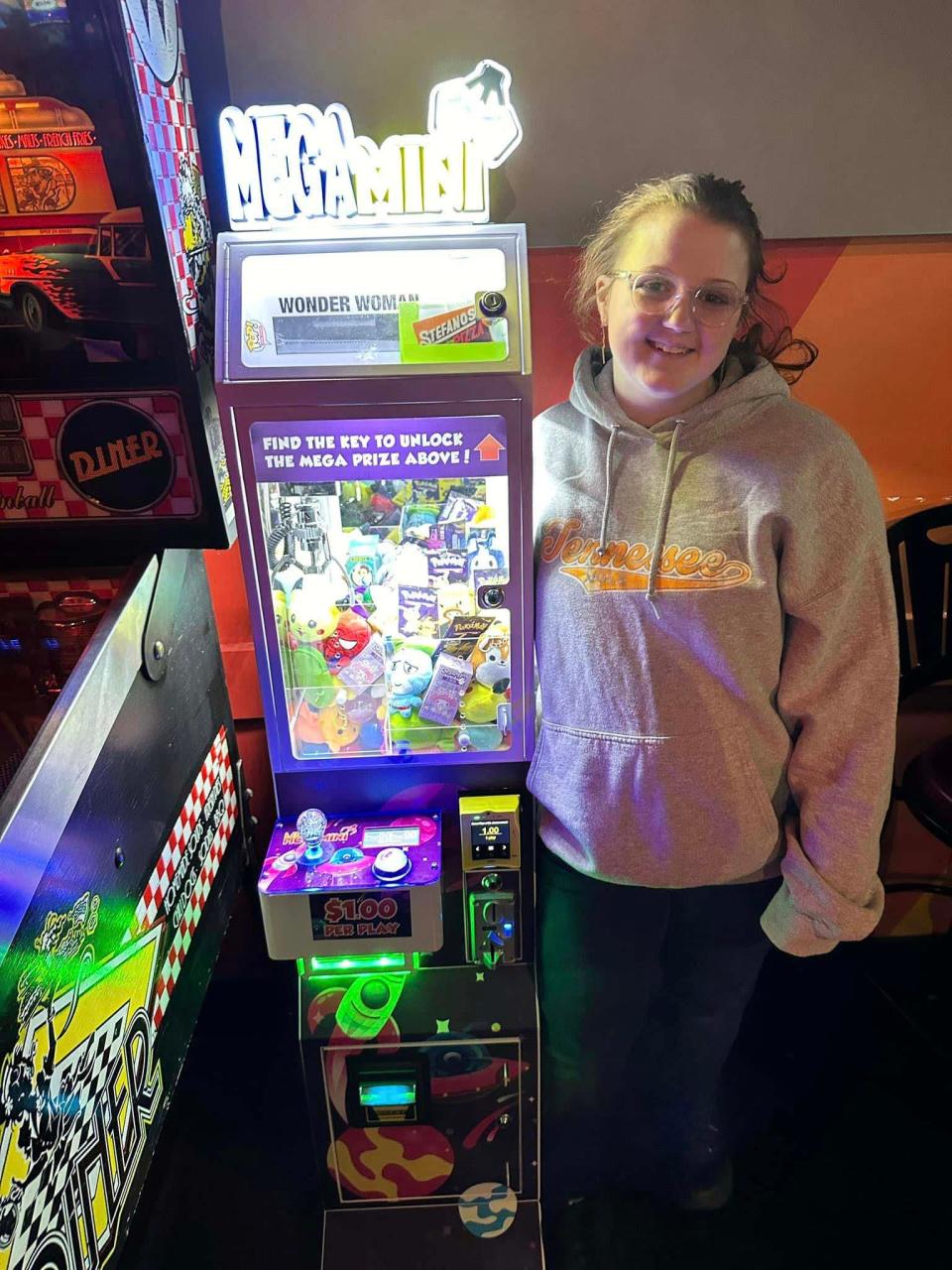 Sarah Wade, 16, said a little snow won’t stop her. She places her latest Mega Mini claw machine at Stefanos in Hardin Valley on Jan 21, 2024.