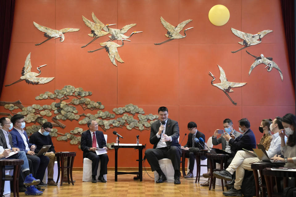 Yao Ming, head of the Chinese Basketball Association and Ice Snow Sports Promotion Ambassador, center, speaks during a Linjia 7 Salon afternoon tea with journalists at Beijing International Club in Beijing, Monday, Jan. 17, 2022. Former NBA great Yao Ming said Monday he and others had a pleasant talk when they met last month with Chinese tennis player Peng Shuai, whose disappearance after making a sexual assault allegation against a former government official raised international concern. (AP Photo/Andy Wong)