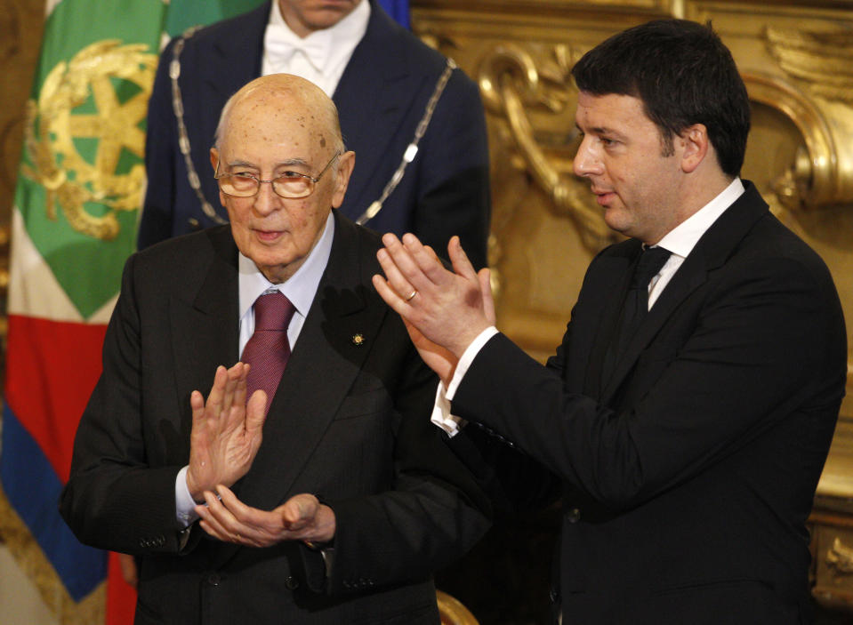 Italian President Giorgio Napolitano, left, and Premier Matteo Renzi, applaud at the end of a swearing in ceremony of the new government at the Quirinale Presidential Palace, in Rome, Saturday, Feb. 22, 2014. Renzi has been sworn in as Italy's youngest premier, heading a new government he says promises will swiftly tackle old problems. (AP Photo/Andrew Medichini)